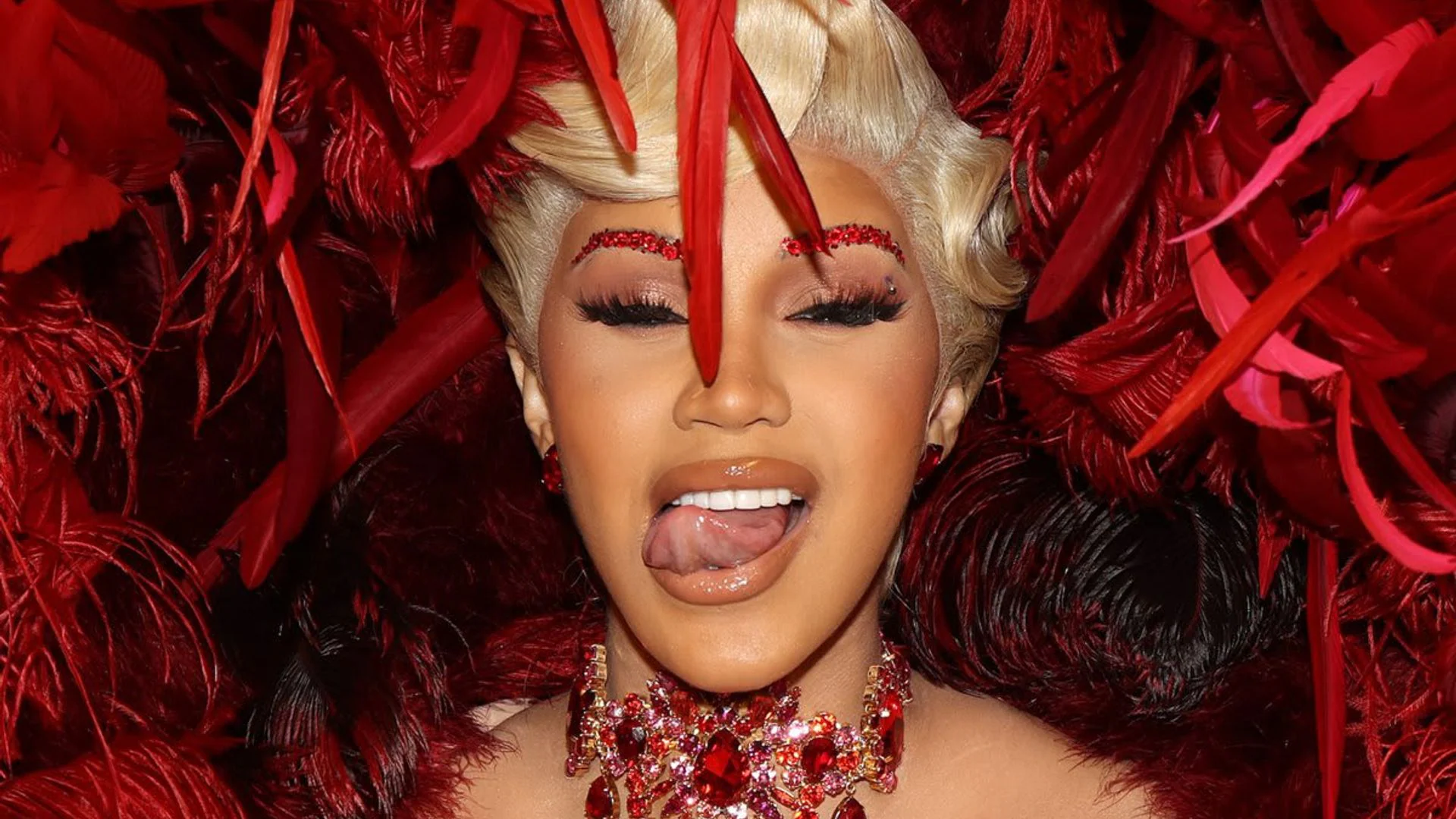 Cardi B in a dramatic transparent Mugler creation with exaggerated proportions at the 2025 Vanity Fair Oscar Party